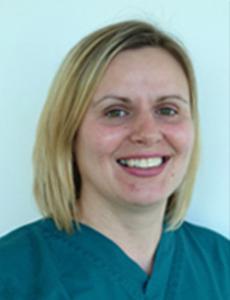 Headshot of Gill Cameron wearing green scrubs