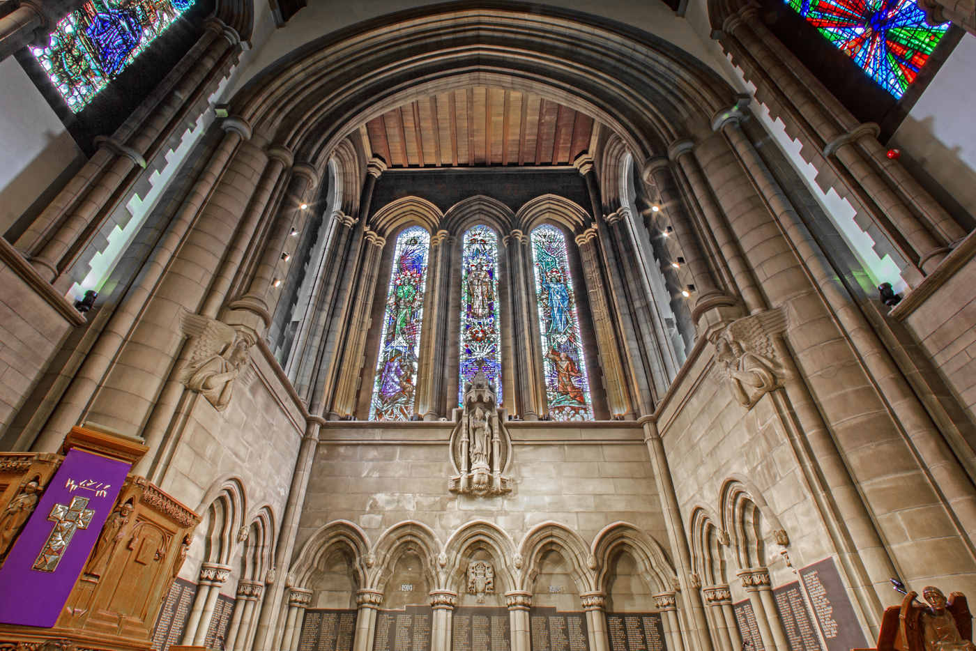 Interior shot of Memorial Chapel with large stained glass window 