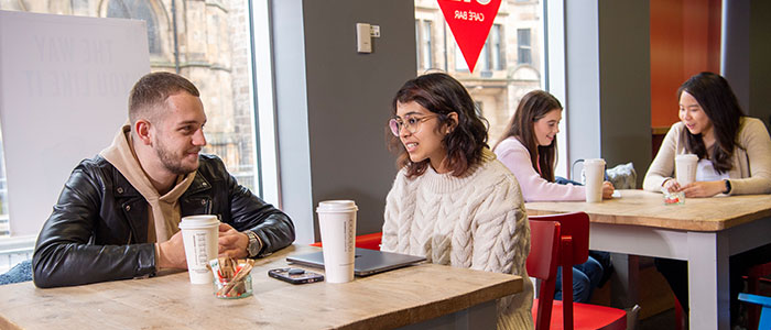 Students drinking coffee in the GUU