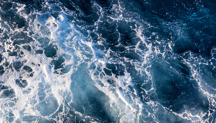 Aerial view of water with foam