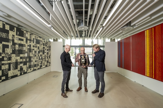 Artist Gregor Harvie (left) examines a voltmeter designed by Lord Kelvin with Professor Stephen Barnett (centre) and Dr Jörg Götte (right) of the University of Glasgow’s School of Physics & Astronomy. Dr Götte was instrumental in arranging the Lord Kelvin: Beyond Absolute Zero exhibition at the ARC.