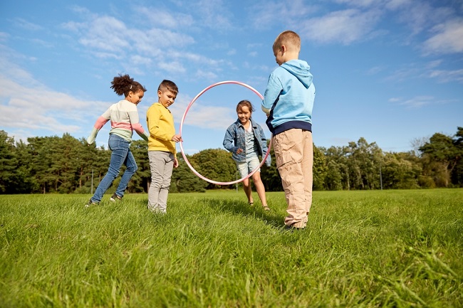 An image of four children playing outdoors