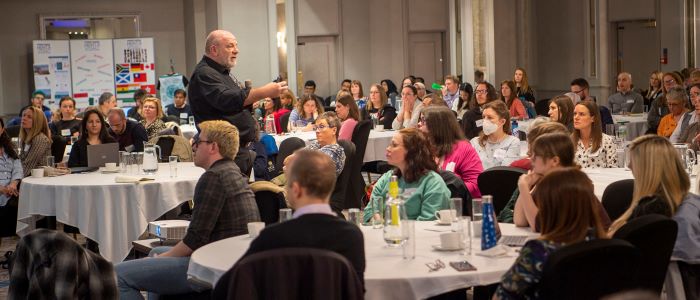 Photo of speaker and participants at research away day 2022