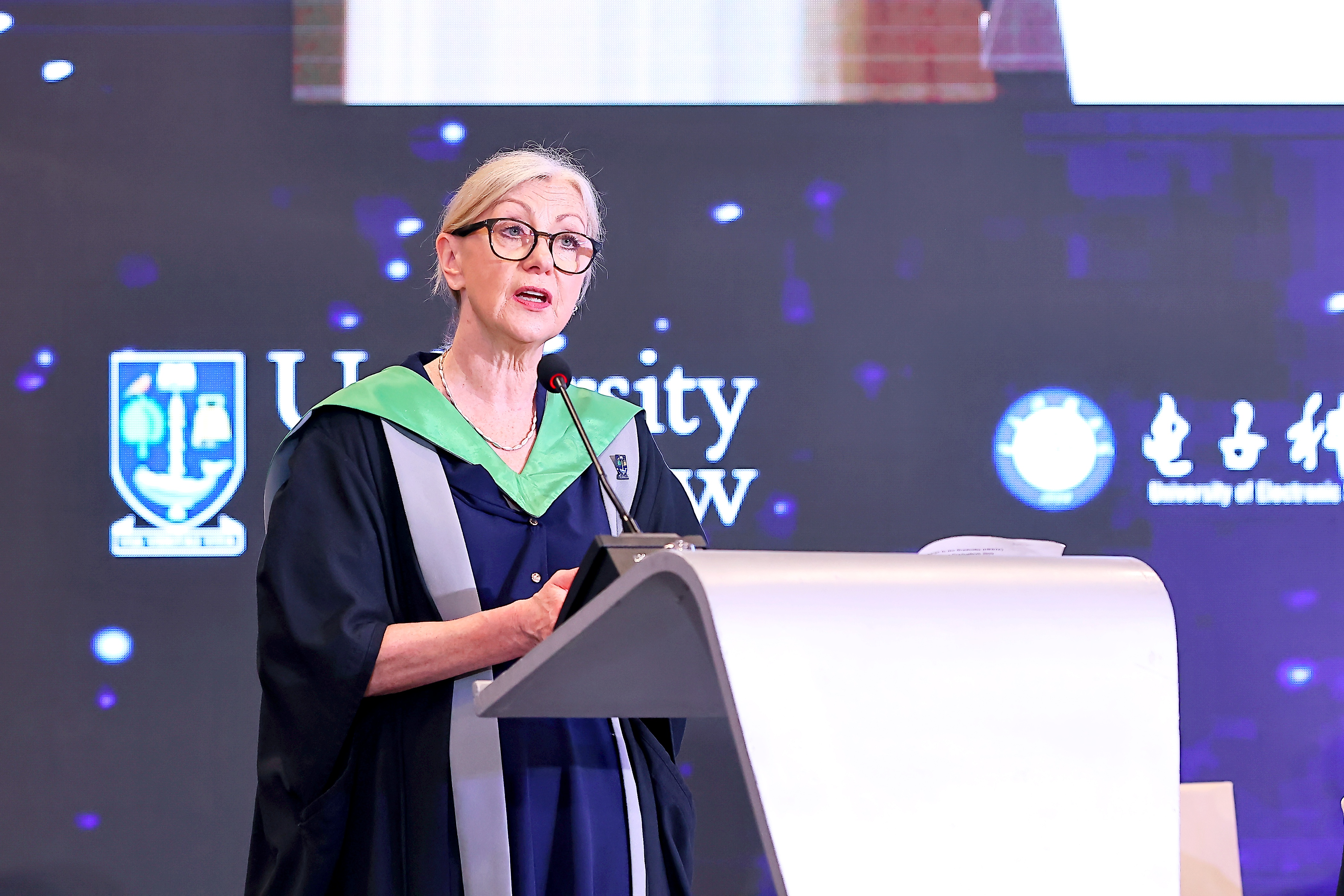 Prof. Sara Carter reads her 'charge' to Graduands in China