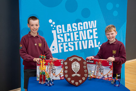 Photograph showing the winning team of Creating Engineers 2024 with the winners trophy and prizes.