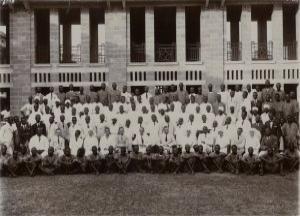 This photograph shows staff members of Lagos Hospital, including doctors, sisters, nurses, dispensers and labourers.  Dr Keer can be found seated in the second row from the front, fifth from the left, April 1931. (GUAS Ref: DC 171/3/15/1/38. Copyright reserved.) 