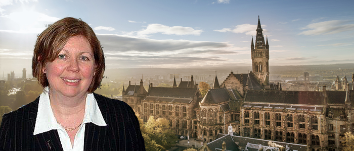 Petrina Sweeney in front of the University Main Building