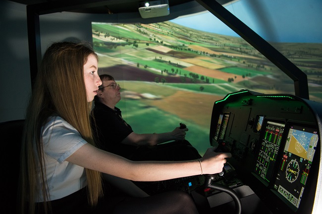 Professor George Barakos and Clydebank High School pupil Katie Buist inside the flight simulator at UofG