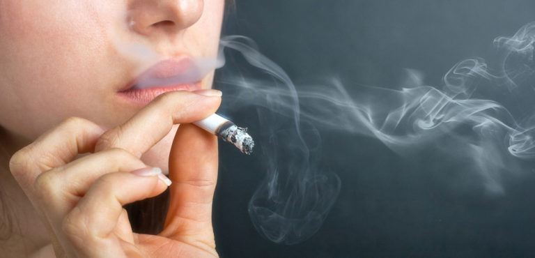 Closeup of female smoking, 768x370px