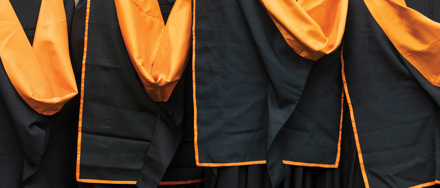 Graduates standing in ceremonial gowns (photo: University of Glasgow Photographic Unit)