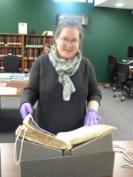 Dr Marina Moskowitz holding archival research materials
