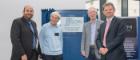 Prof David Bhella, Dr Richard Henderson, Prof Richard Cogdell and Prof Sir Anton Muscatelli unveiling a plaque at the SCMI opening symposium