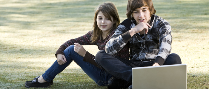 Photo of two young people in park