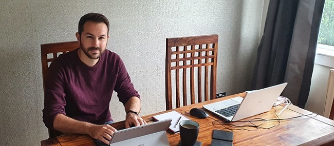 Jamie Wightwick sat working at his dining room table