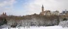 Snowy photo of Gilmorehill take from Kelvingrove Park