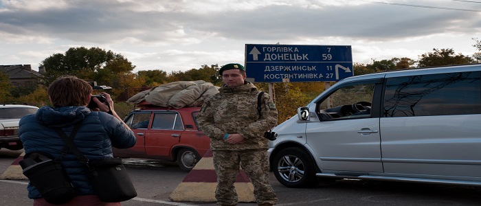 A soldier having his photo taken