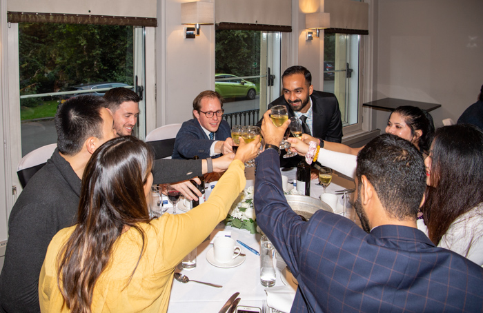 Guesting toasting drinks at the 2022 MBA reunion dinner