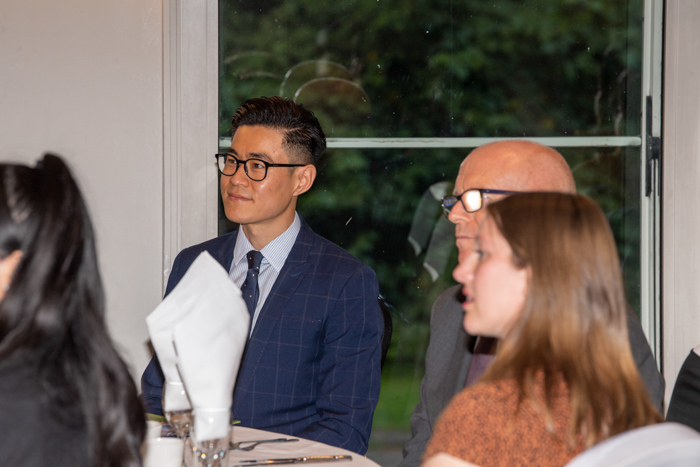 Guests listening to talks at the 2022 MBA reunion dinner