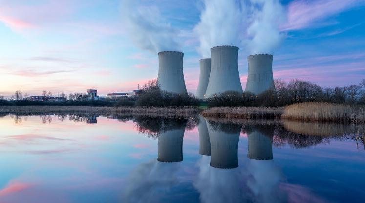 Nuclear power plant with reflection of buildings in water