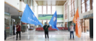 Some of the students of Glasgow College Hainan UESTC waving flags at the airport