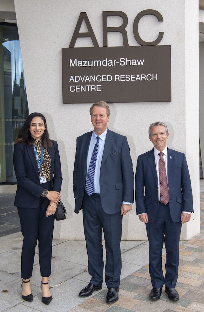 A photo of Uzma Khan (l) and Frank Coton of the University of Glasgow with Secretary of State for Scotland Alister Jack